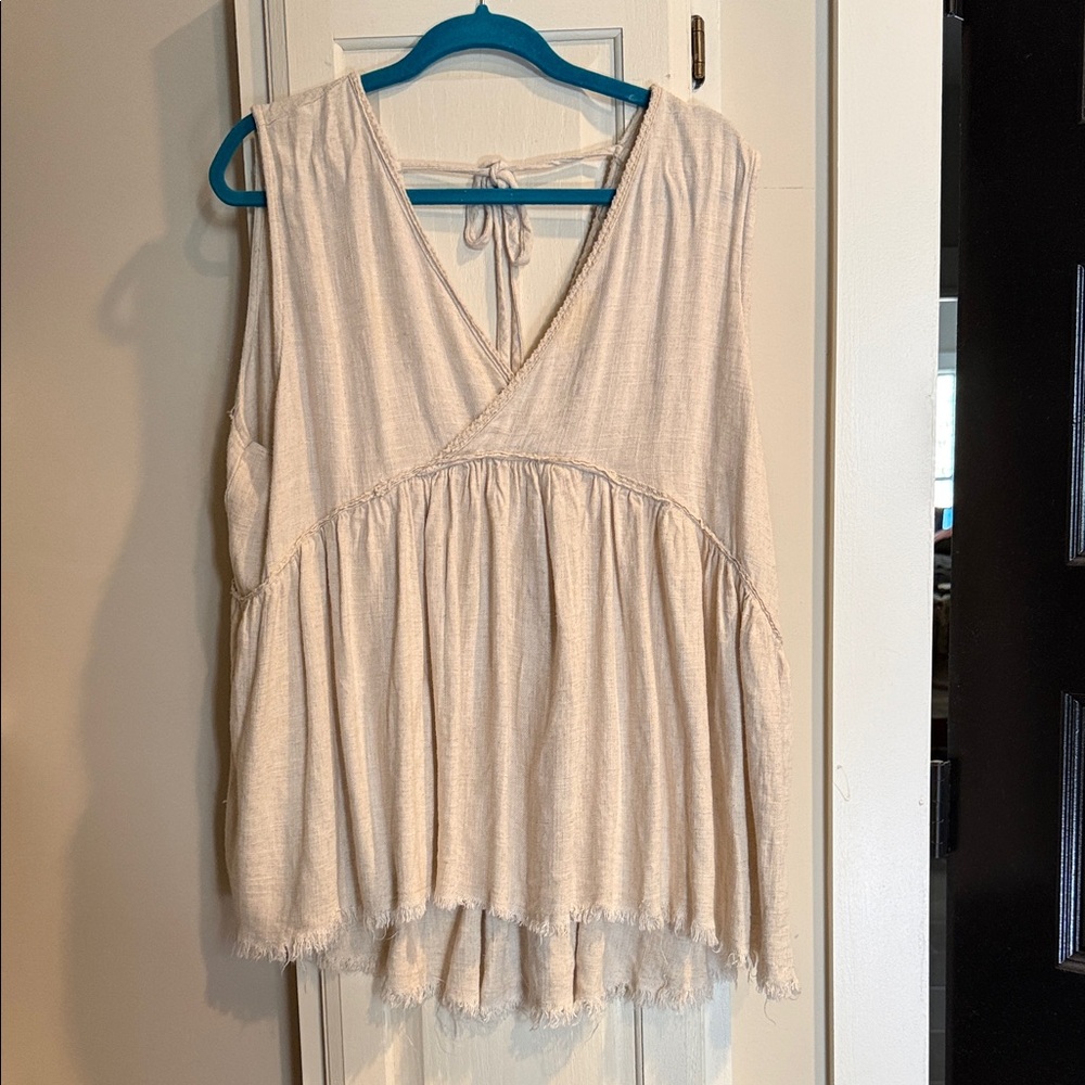 Umgee cream shirt - high low style with raw hem.  Tie back and crossover front.